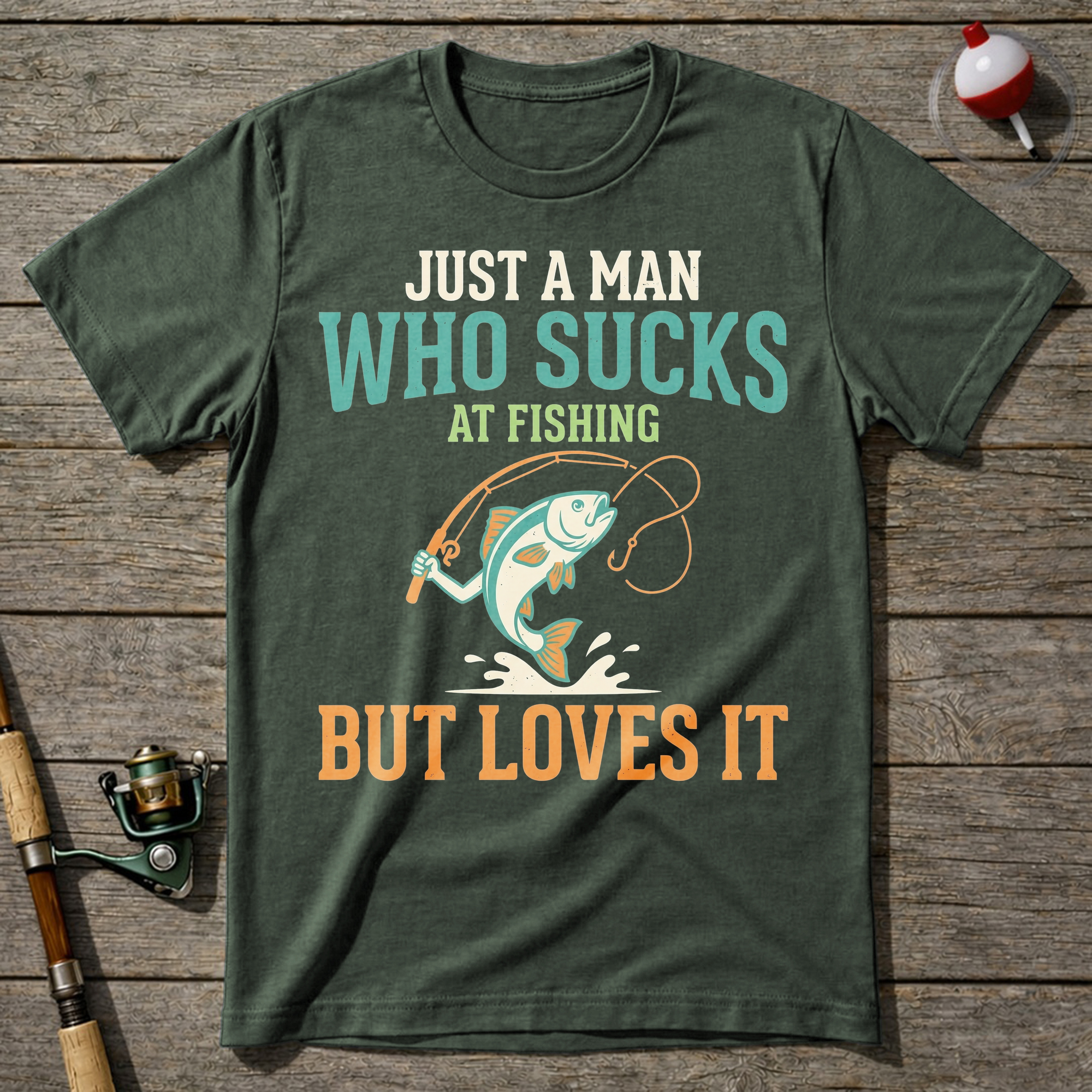 Sucks At Fishing But Loves It T-Shirt — Military Green